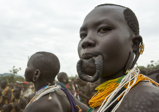 Suri tribe woman with enlarged lip and scarifications, Kibish, Omo valley, Ethiopia