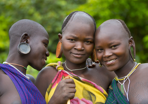 Suri tribe women with enlarged earlobe, Kibish, Ethiopia