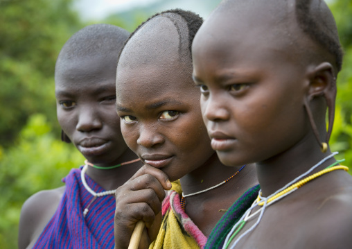 Suri tribe women with enlarged earlobe, Kibish, Ethiopia