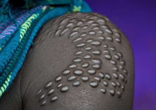 Details of scarifications on a Suri tribe woman shoulder, Kibish, Omo valley, Ethiopia