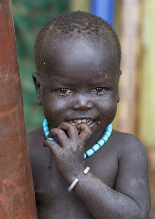 Suri tribe kid smiling, Kibish, Omo valley, Ethiopia
