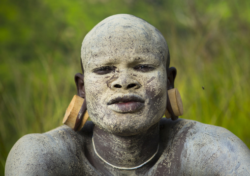 Suri tribe shepherd with body paintings for camouflage, Tulgit, Omo valley, Ethiopia