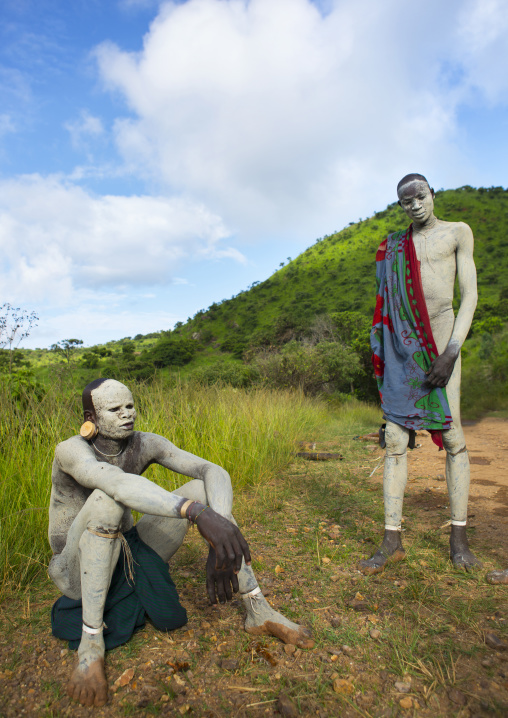 Suri tribe shephers with body paintings as camouflage, Tulgit, Omo valley, Ethiopia