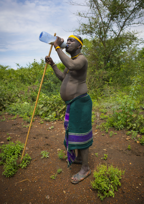 Bodi Tribe Warrior Drinking Milk, Near Hana Mursi, Omo Valley, Ethiopia