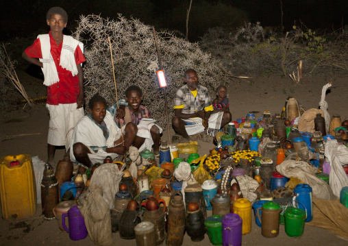 Night Shot Of Karrayyu Tribe Men And Boys Waiting Near The Food Brought For The Gadaaa Ceremony, Metahara, Ethiopia