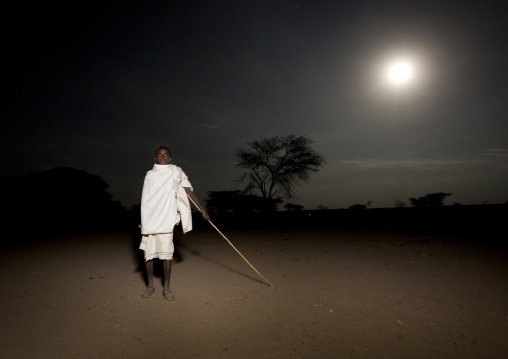 Night Shot Portrait Of A Young Karrayyu Tribe Man Under Full Moon During Gadaaa Ceremony, Metahara, Ethiopia