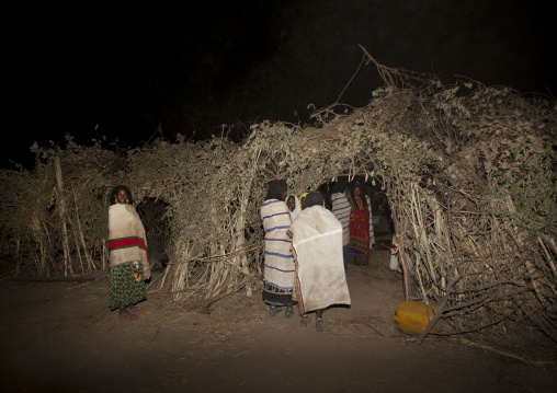Night Shot Karrayyu Tribe Women Near A House Built For Gadaaa Ceremony, Metehara, Ethiopia