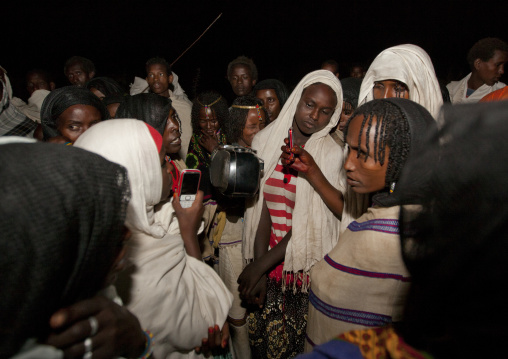 Night Shot Of A Group Of Karrayyu Tribe Women Singing And Recording Themselves During Gadaaa Ceremony, Metehara, Ethiopia