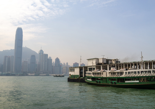 A star ferry leaving its Tsim Sha Tsui pier in kowloon to reach the central pier, Special Administrative Region of the People's Republic of China , Hong Kong, China