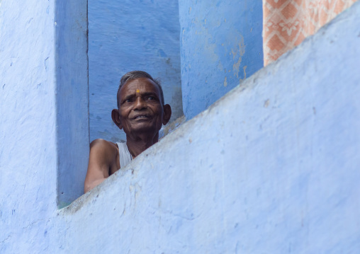 Indian man in an old blue house of a brahmin, Rajasthan, Bundi, India