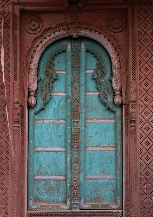 Beautiful blue wooden door of a haveli in the old city, Rajasthan, Bikaner, India