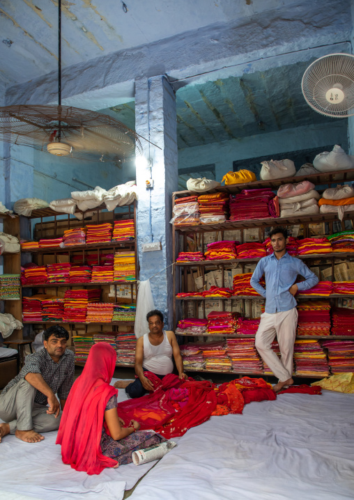 Indian woman buying sari in a shop, Rajasthan, Jodhpur, India
