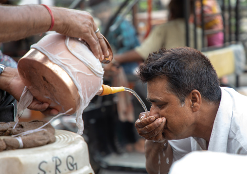 Indian volunteer distributing water for free during the heat wave, Rajasthan, Jaipur, India
