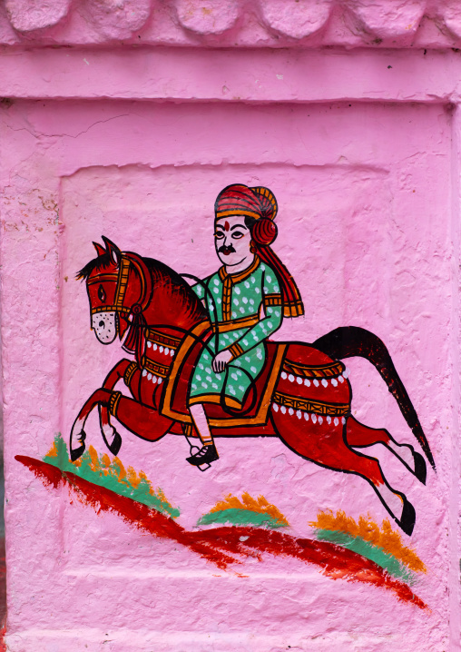 Murals depicting a horseman on a pink haveli, Rajasthan, Bundi, India