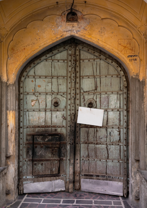 Old wooden door of a haveli, Rajasthan, Jaipur, India