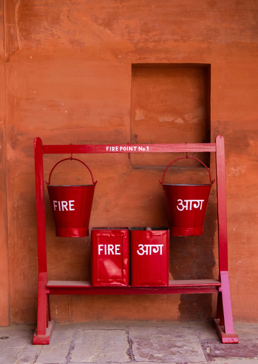 Fire buckets hanging by hooks in Junagarh fort, Rajasthan, Bikaner, India