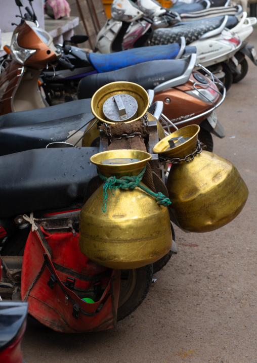 Milk jugs on a motorbike, Rajasthan, Bundi, India