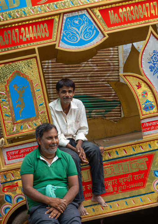 Portrait of indian musician sit on their rickshaw, Rajasthan, Bundi, India