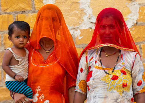 Portrait of rajasthani women with face hidden by their saris, Rajasthan, Jaisalmer, India