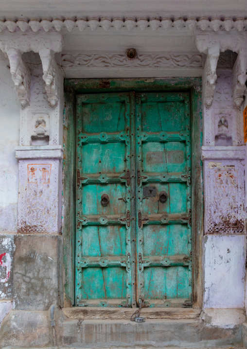 Green wooden door of a haveli, Rajasthan, Jodhpur, India