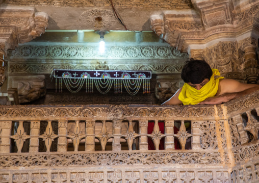 Indian priest covering his mouth inside a jain temple, Rajasthan, Jaisalmer, India