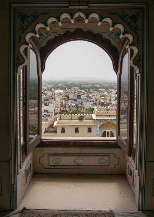 Window with a city view in the city palace, Rajasthan, Udaipur, India