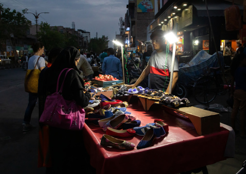 Shoes seller in the night market, Rajasthan, Jodhpur, India