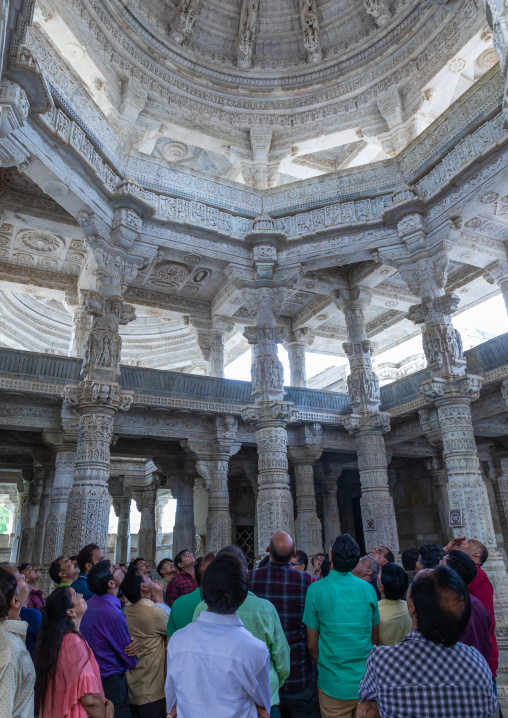 Indian tourists inside jain Tirthankar marble temple, Rajasthan, Ranakpur, India