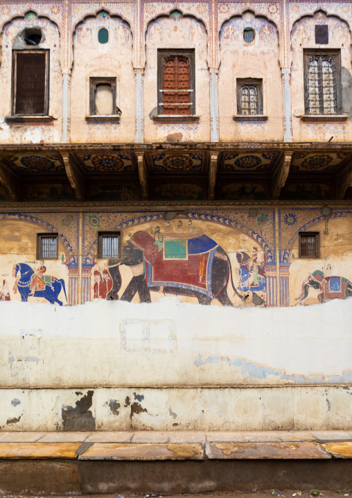 Wall paintings depicting indian people on an elephant on an old haveli, Rajasthan, Nawalgarh, India