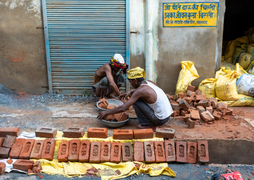 Indian workers building a house with bricks, Rajasthan, Nawalgarh, India