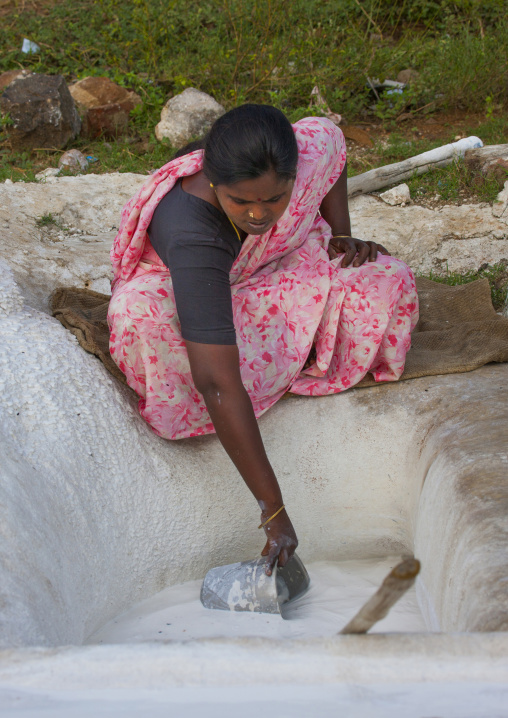 Squatting Woman Drawing Lime With A Bucket, Madurai, India