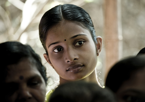 Attentive Young Woman In The Audience During Theyyam Ceremony, Thalassery, India