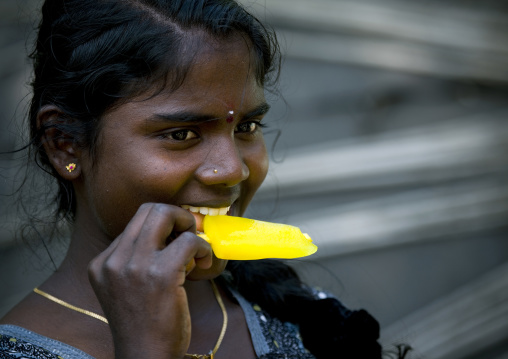Young Girl With Piercing In The Nose Eating A Ice Cream, Mahabalipuram, India
