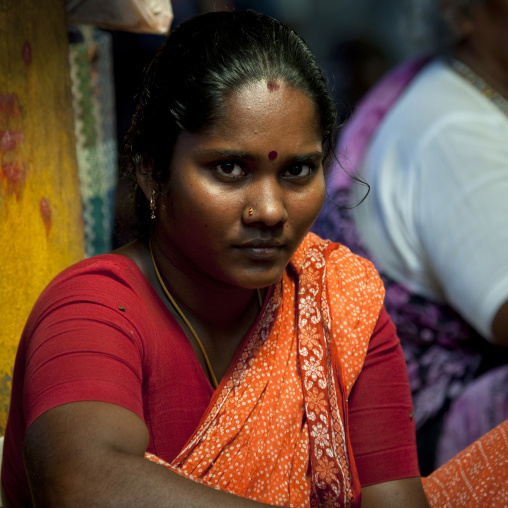 Hindu Woman With Bindi In Sari Sitting On A Temple, Pondicherry, India