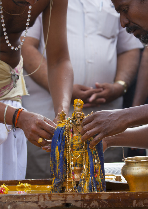 Men Decorating A Golden Icone With Jewellery And Color Paste During The Masi Magam Festival, Pondicherry, India