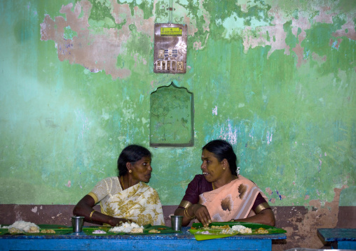 Women In Sari In Front Of A Decrepit Wall Talking During Lunchtime At A Wedding, Kumbakonam, India