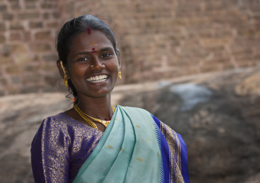 Young Smiling Woman In Sari Wearing Traditional Painting On Her Forehead At The Tirumayam Fort, Tirumayam, India