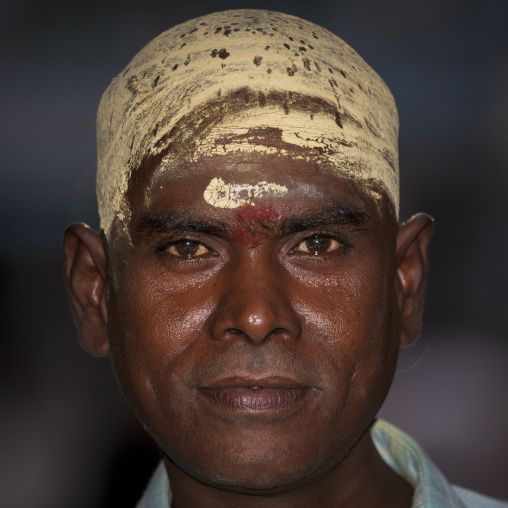 Portrait Of A Indian Man With Shaved Head Covered With Sandalwood Paste At The Sri Ranganathaswamy Temple, Trichy, India
