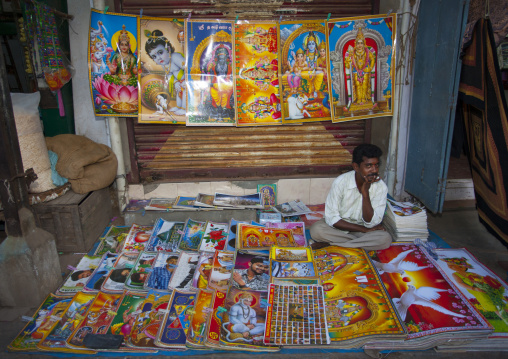 Thoughtful Posters' Seller Sitting Behind His Colorful Stalls, Trichy, India