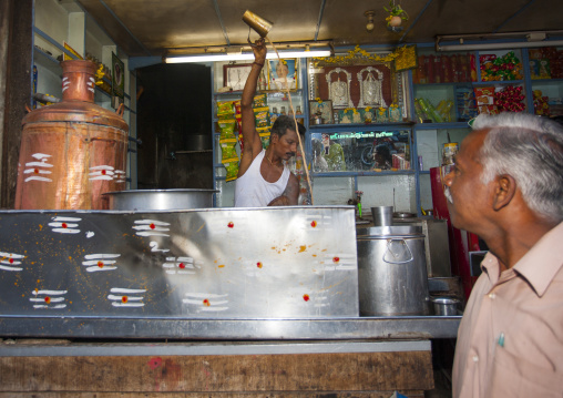 Man Preparing A Beverage Behind His Worktop In A Restaurant, Trichy, India