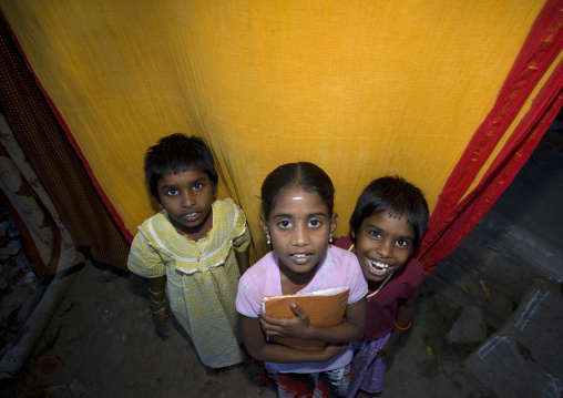 Three Little Indian Grils Posing In Front Of A Colored Curtain, Trichy, India