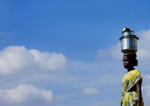 Young Woman Bringing Water On A Jar Posed On The Top Of Her Head In South India, Madurai