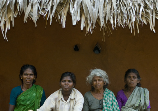 Group Of Women Of Mixed Age Range Sitting In Front Of An Adobe House Madurai, India