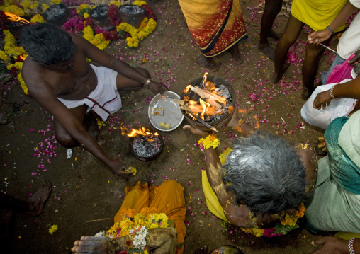 Sittinge People With Offerings Behind Them Preparing Jars On Fire For Fire Walking Ritual, Madurai, South India