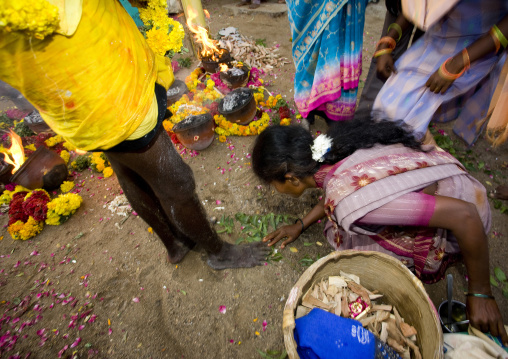 Woman Inspecting The Ashes Covered Feet Of Someone Who Succeeded At Fire Walking Ritual, Madurai, South India