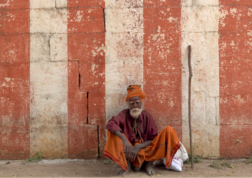 Old Sadhu Squatting In Front Of A Temple, Mahabalipuram, India