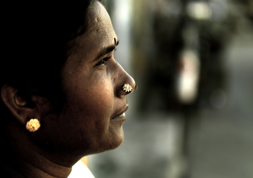 Close Up Of A Woman With Nose Piercings And Bindi Looking Away, Pondicherry, India