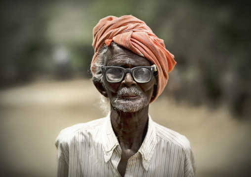 Old Keeper Of The Ayyanar Temple Wearing Glasses And A Turban, Pudukkottai, India