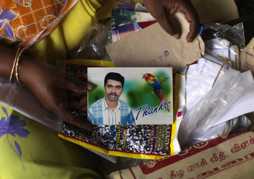 Indian Matchmaker Presenting The Card Of A Bachelor Looking For A Bride, Madurai , India