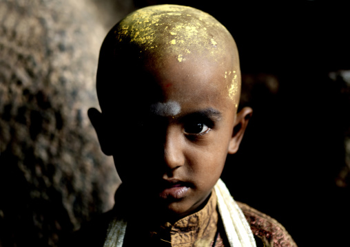 Young Boy With Shaved Head And Sandalwood Paste On It In A Madurai's Temple, India